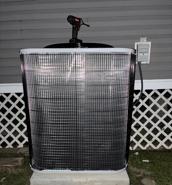 New outdoor AC condensing unit fully installed on pad
